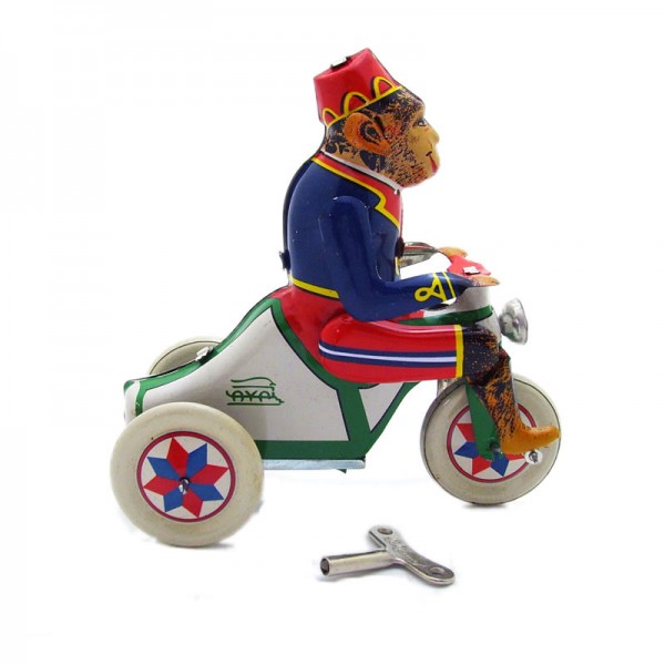 Monkey Rides Bike Wind Up Tin Toy