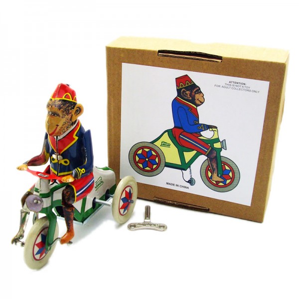 Monkey Rides Bike Wind Up Tin Toy